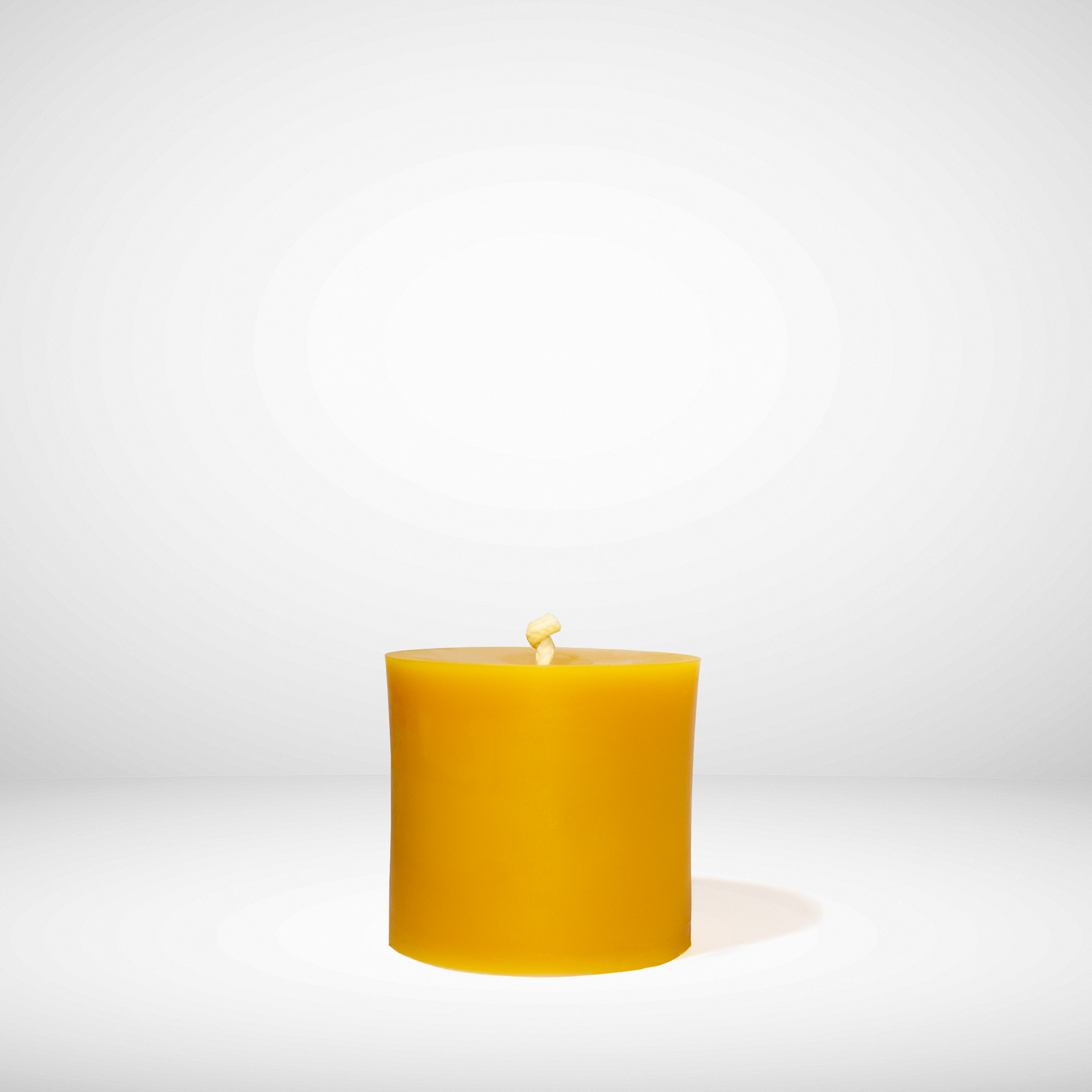 Beeswax candle on a white background