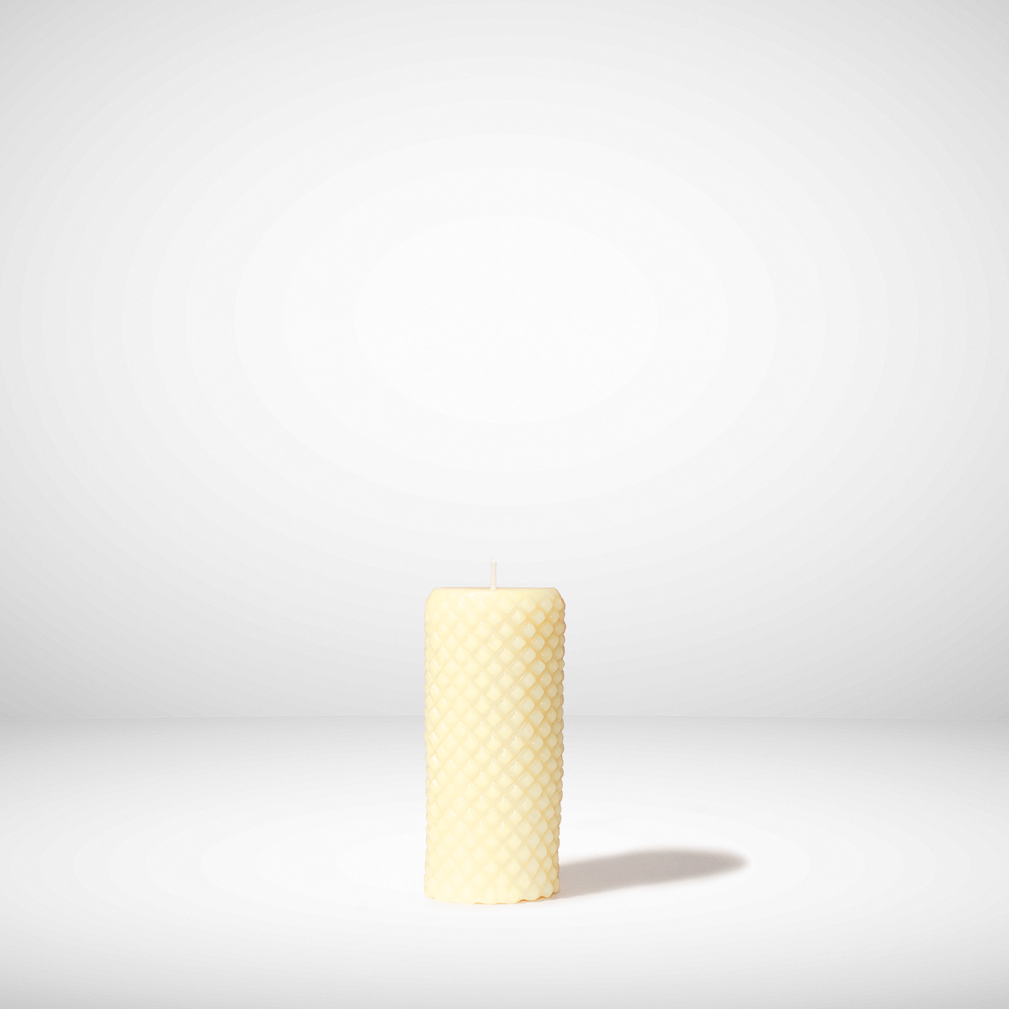 Ivory Beeswax candle on a white background