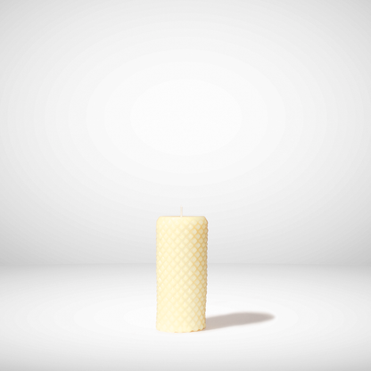 Ivory Beeswax candle on a white background