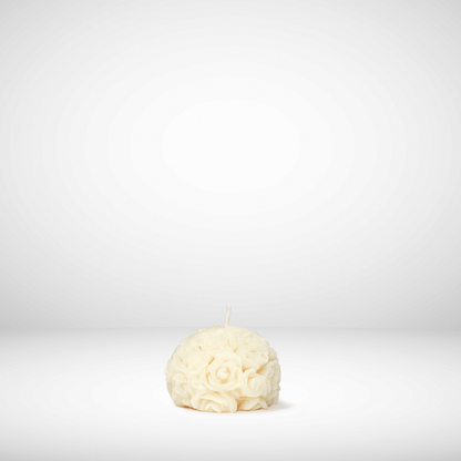 White floral beeswax candle on a white background