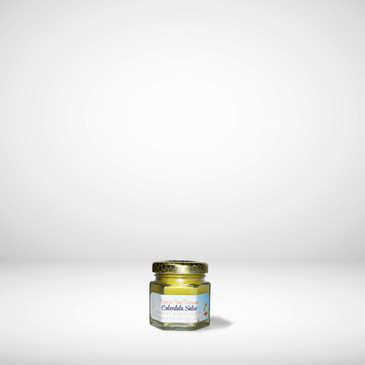 Small jar of Calendula Salve on a white background