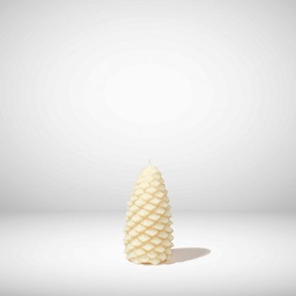 White textured beeswax candle on a light gray background