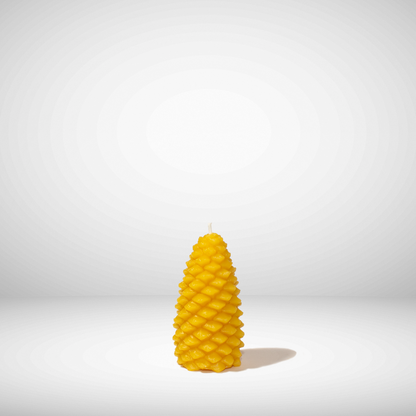 A yellow beeswax candle shaped like a pinecone, set against a neutral background