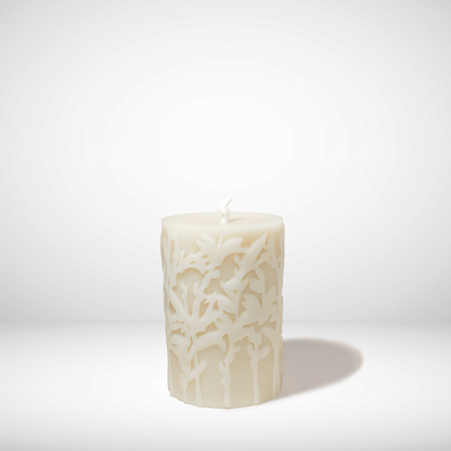 Decorative beeswax candle with a textured pattern on a white background